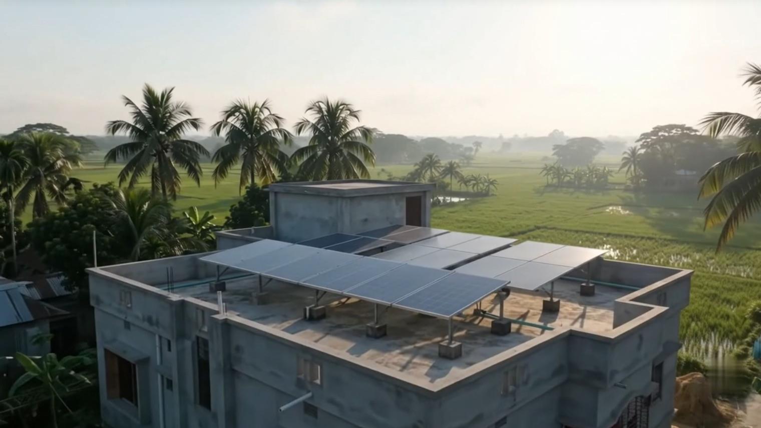 Solar panels installed on the flat roof of a concrete house