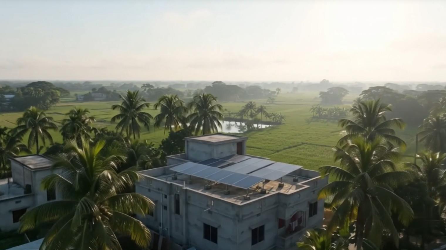 House with solar panels on the roof, surrounded by palm trees and fields